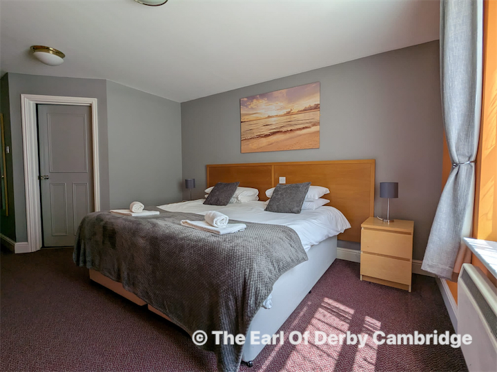 People at a concert facing the stage with various colours of paint powder in the air